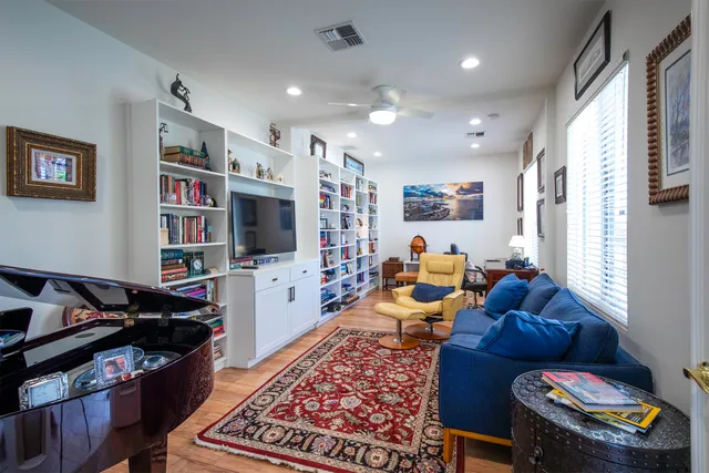 a living room with furniture fireplace and a flat screen tv