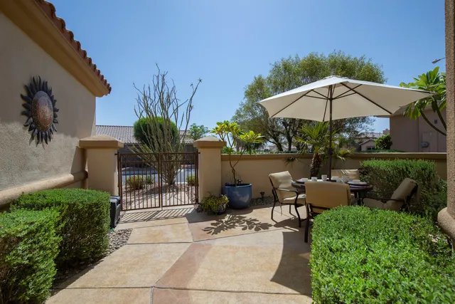 a view of a backyard with sitting area