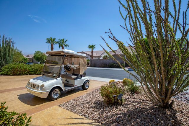 a view of a backyard with sitting area