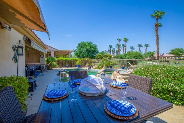 a view of a table and chairs in patio