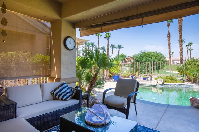 a outdoor living space with furniture and a potted plant