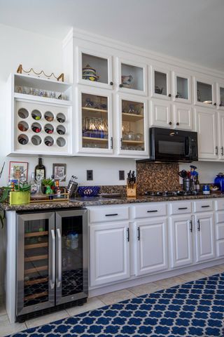a kitchen with stainless steel appliances granite countertop a stove and cabinets