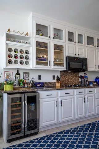 a kitchen with stainless steel appliances granite countertop a stove and cabinets