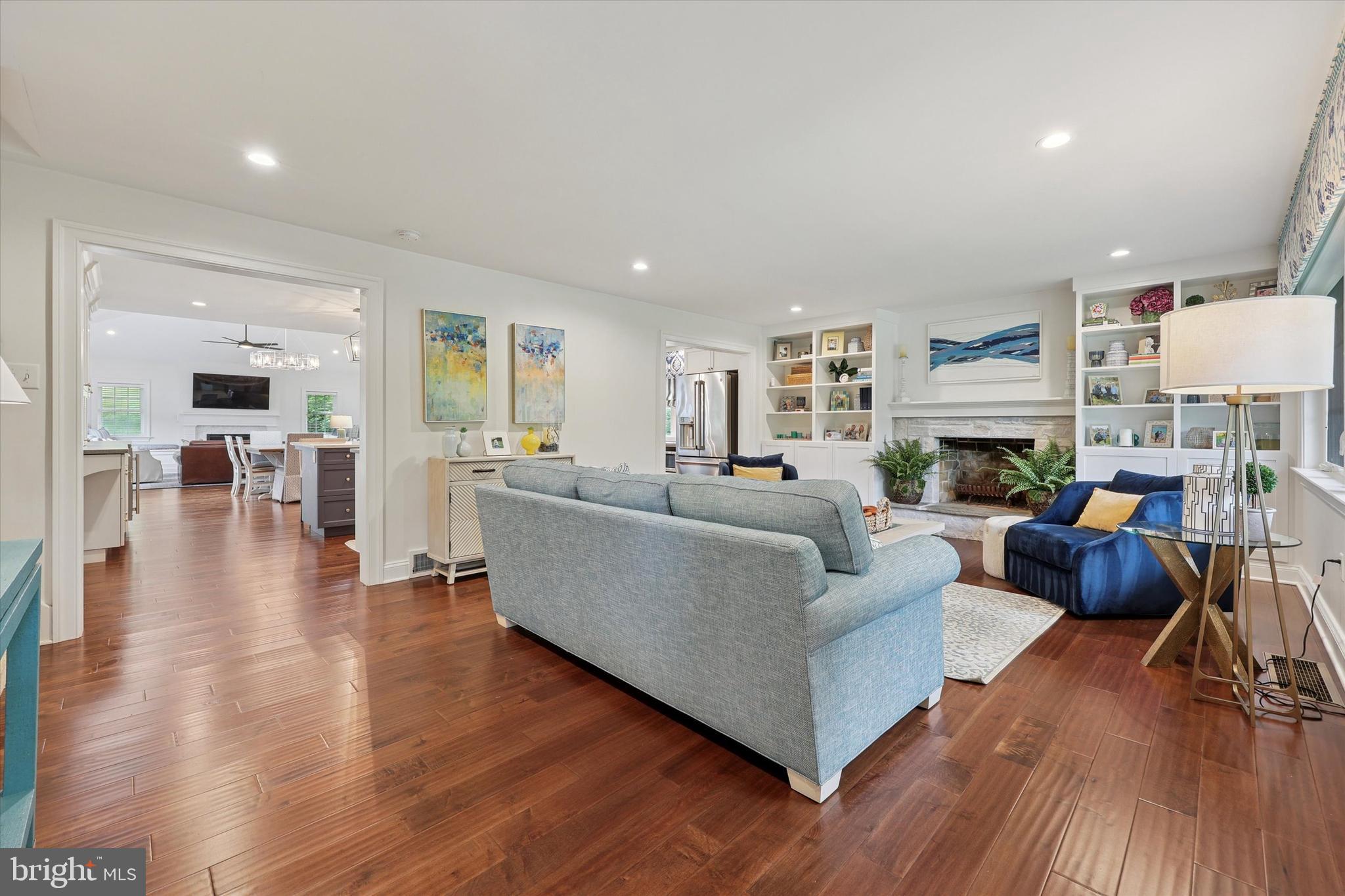280 Deepdale Road Wayne, PA 19087 - Photo 13 of 35 a living room with fireplace furniture and a wooden floor