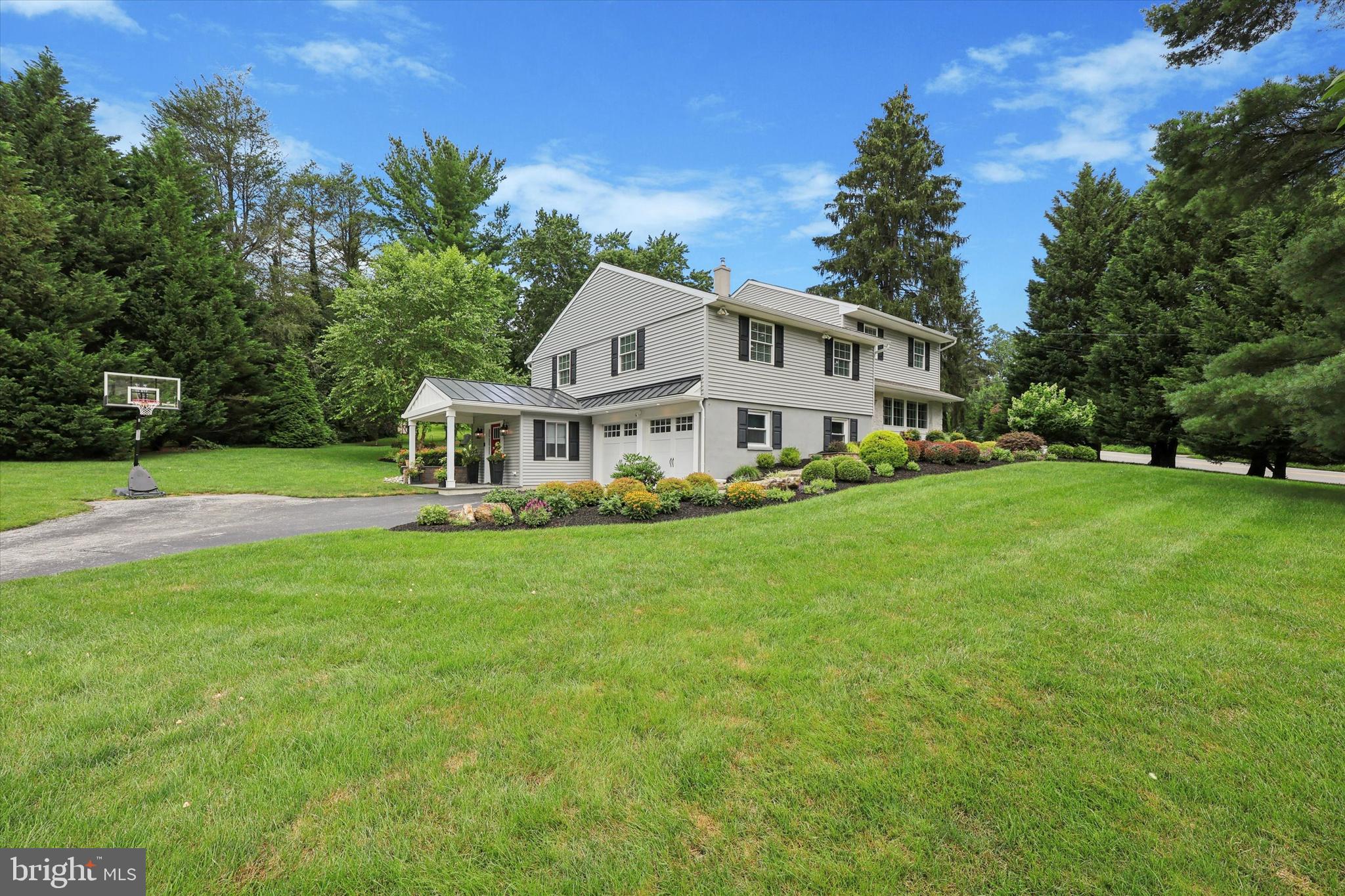 280 Deepdale Road Wayne, PA 19087 - Photo 35 of 35 a front view of a house with a yard table and trees