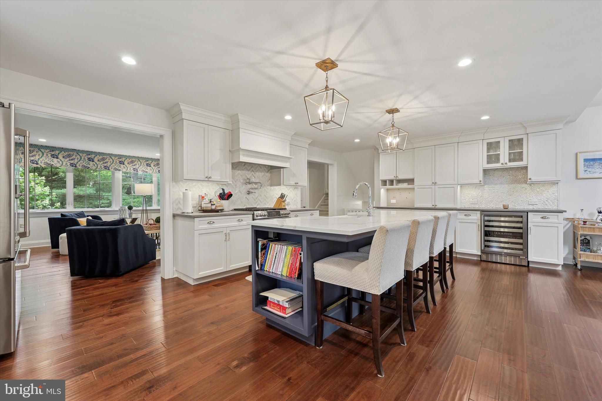 280 Deepdale Road Wayne, PA 19087 - Photo 10 of 35 an open kitchen with wooden floor and stainless steel appliances
