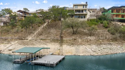 a view of a lake with a house in the background