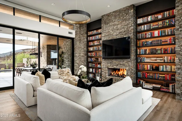 a dining room with furniture window and wooden floor