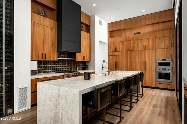 a bathroom with a granite countertop sink a toilet and shower