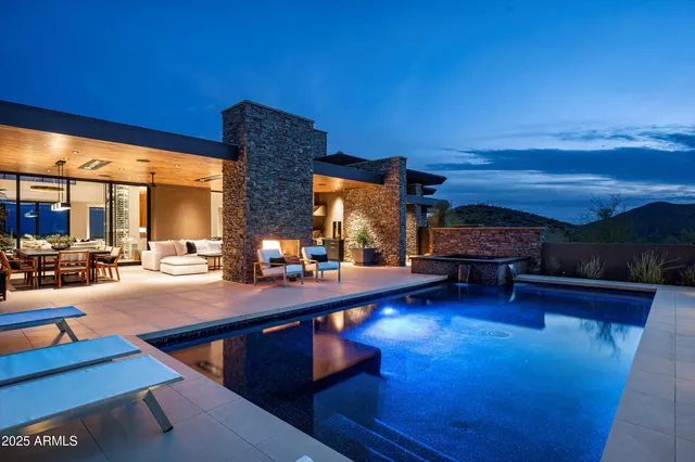 a living room with fireplace furniture and a flat screen tv