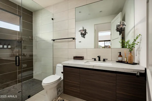 an aerial view of a house with a garden and mountain view