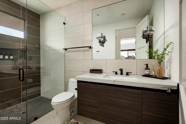 an aerial view of a house with a garden and mountain view