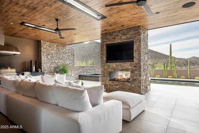 an aerial view of a house with a swimming pool