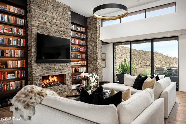 a kitchen with stainless steel appliances granite countertop a refrigerator and a wooden floor