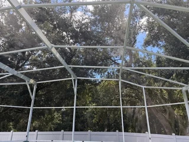 a view of a fence and a window