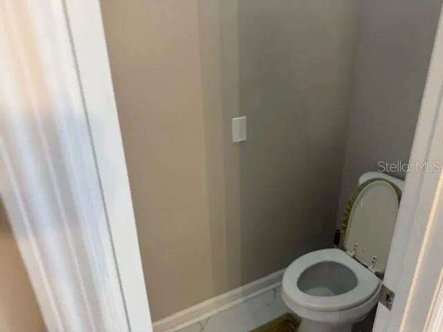 a bathroom with a toilet and a sink