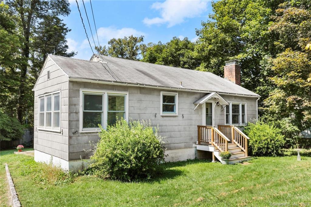 39 Crest Road Ridgefield, CT 06877 - Photo 1 of 1 a view of a house with a yard and sitting area