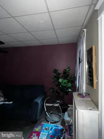 a room with furniture and musical instruments