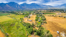 19 East Southfield Road Spanish Fork, UT 84660 - Photo 49 of 74 View of rural area featuring extensive farmland and a mountain backdrop