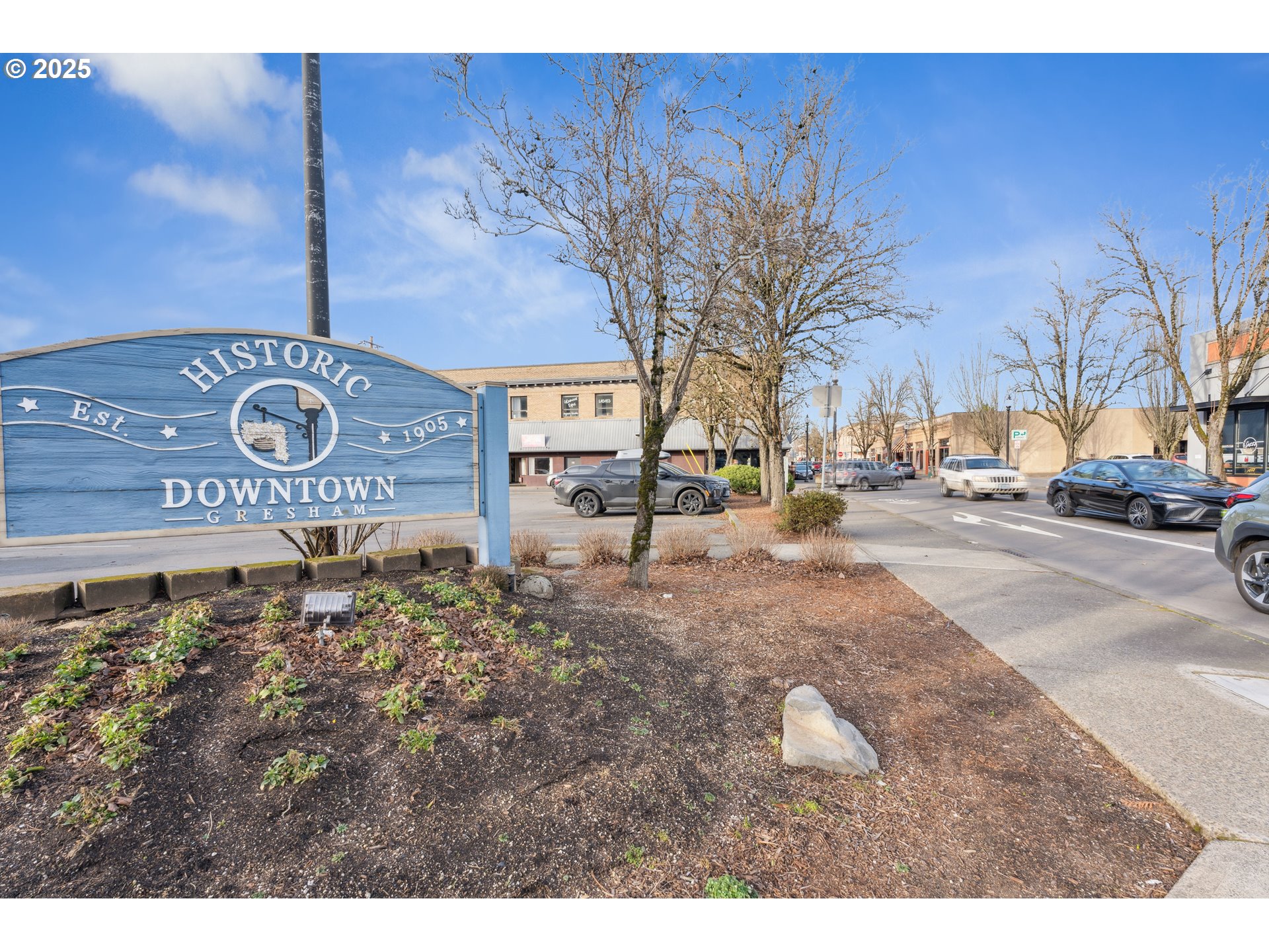 3065 Southwest Duniway Avenue Gresham, OR 97080 - Photo 21 of 24 a street sign on a sidewalk next to a road