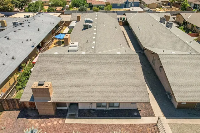a front view of a house with a yard and a garage