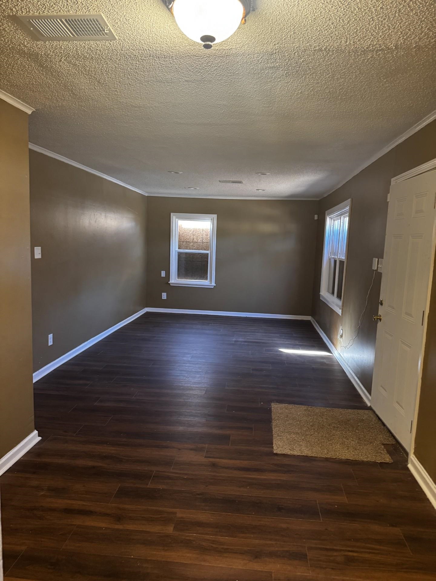 3271 Seminole Road Memphis, TN 38111 - Photo 8 of 8 a view of an empty room with wooden floor and a window