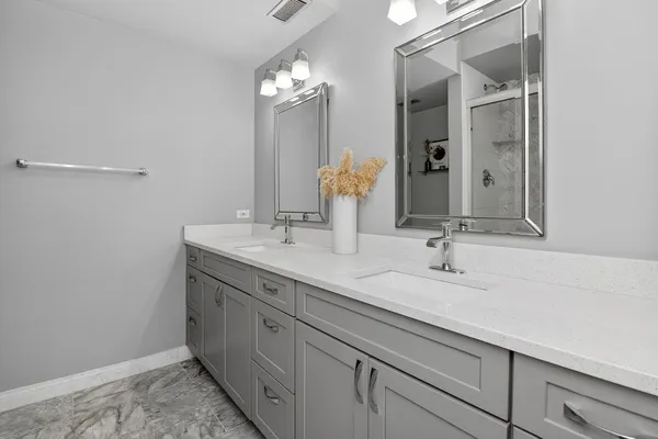 a bathroom with a sink and a shower