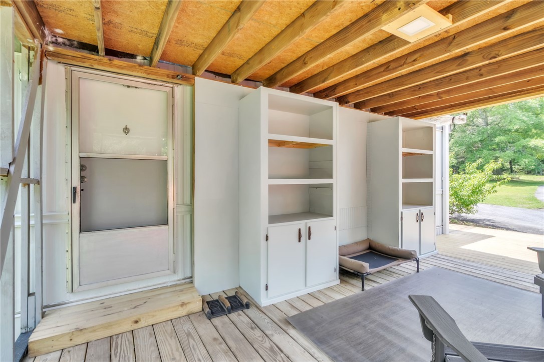 506 Charlies Creek Road Iva, SC 29655 - Photo 21 of 28 A spacious wood-floored patio offers ample outdoor living space.
