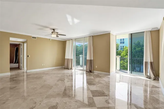 a kitchen with stainless steel appliances a stove a microwave and a white cabinets
