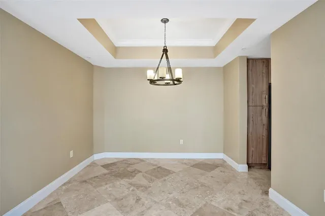 a kitchen with stainless steel appliances granite countertop a stove microwave and refrigerator