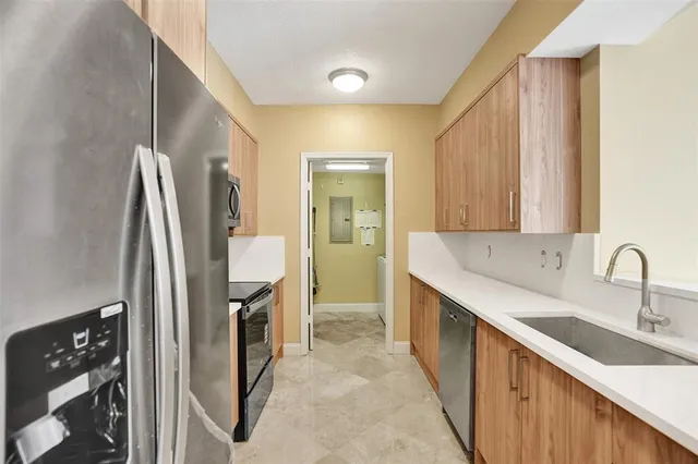 a view of a livingroom with a ceiling fan and window