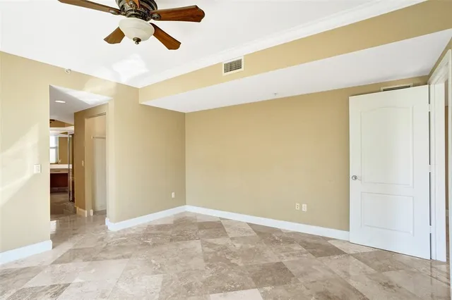 a bathroom with a glass shower door and a shower