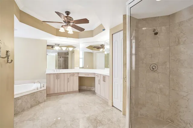 a bathroom with a shower and a sink