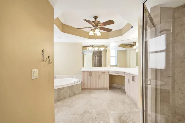 a row of palm trees in front of a building