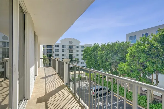 a view of a house with pool fire pit and chairs in a patio
