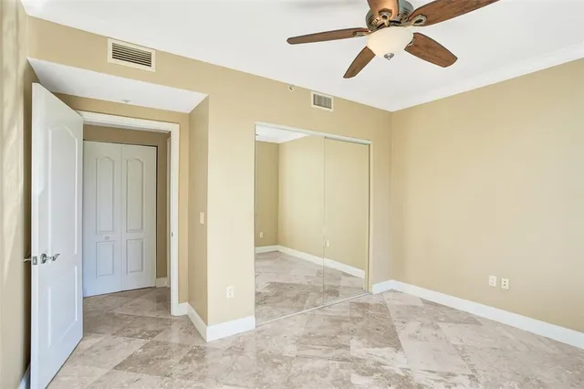 a view of an empty room with glass door