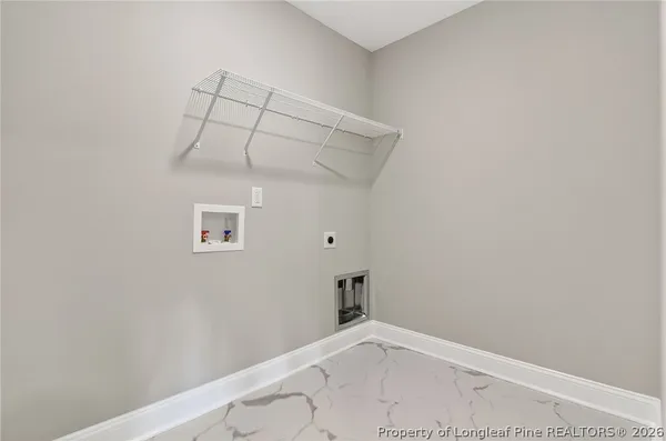 a bathroom with a granite countertop toilet sink and mirror