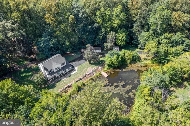 a backyard of a house with yard and outdoor seating
