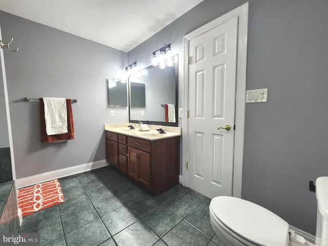 a bathroom with a bathtub and shower