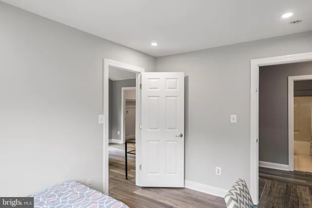 a bathroom with a sink vanity granite toilet tub and shower