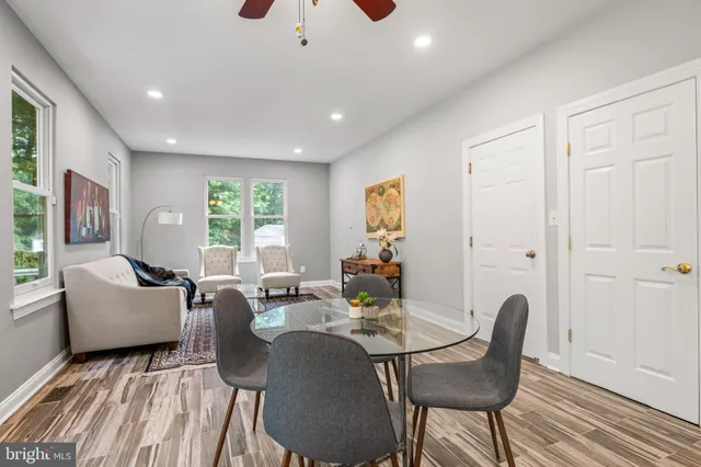 a living room with furniture a window and a table