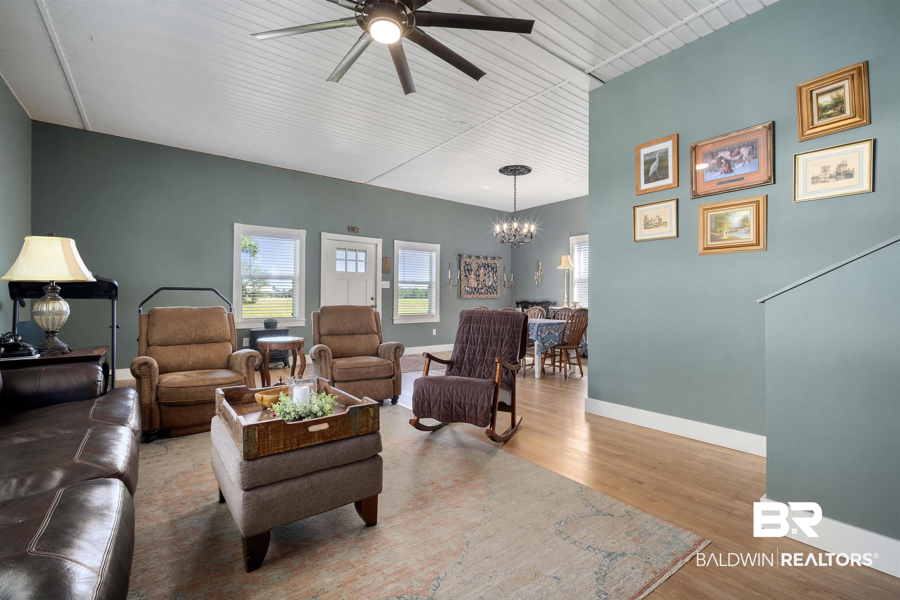 22 Horace Odom Road Millry, AL 36558 - Photo 14 of 39 Living area with ceiling fan, light wood-style floors, and hanging lights
