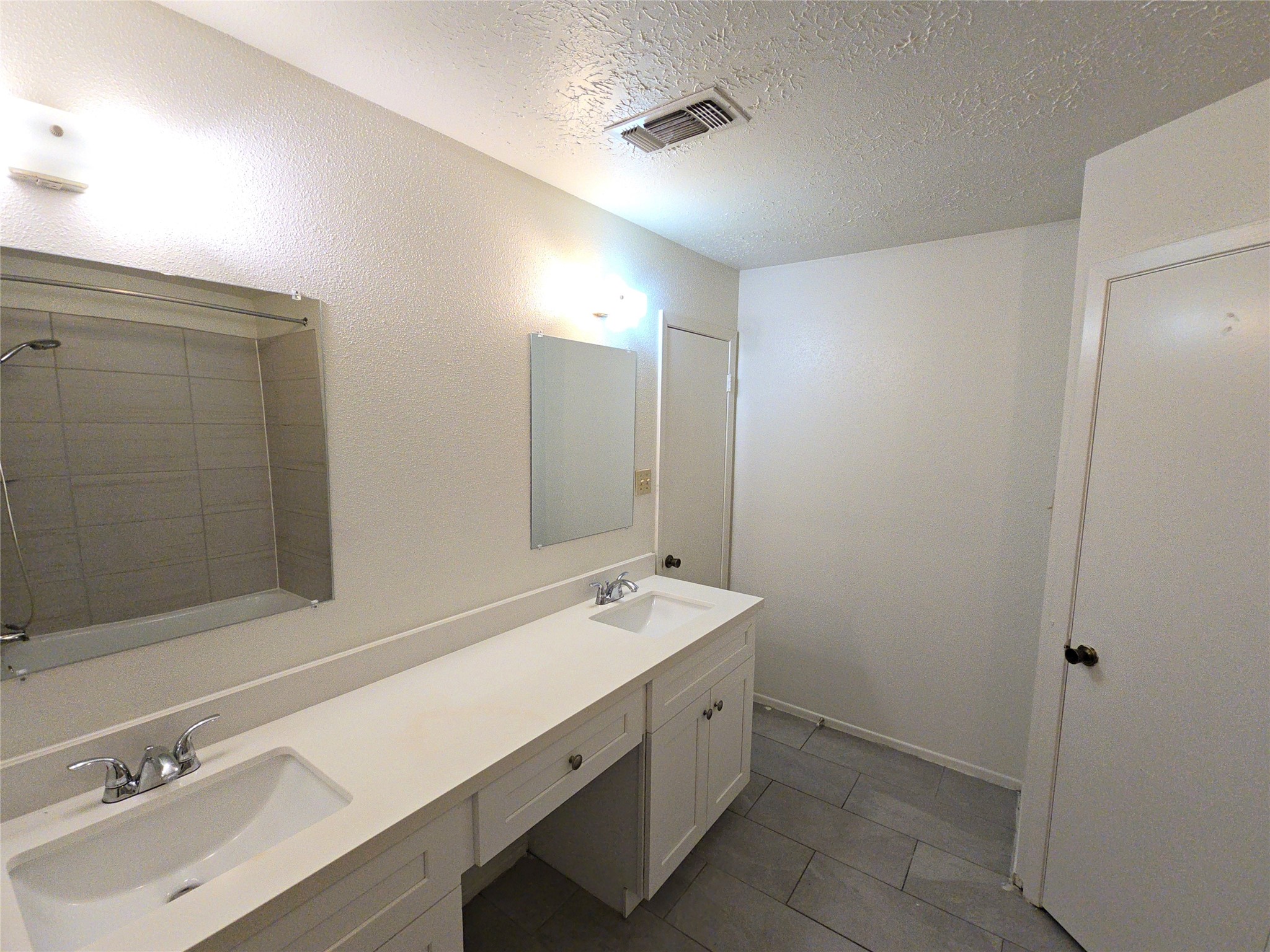10906 Maple Rock Drive Humble, TX 77396 - Photo 17 of 27 a bathroom with a sink and a mirror
