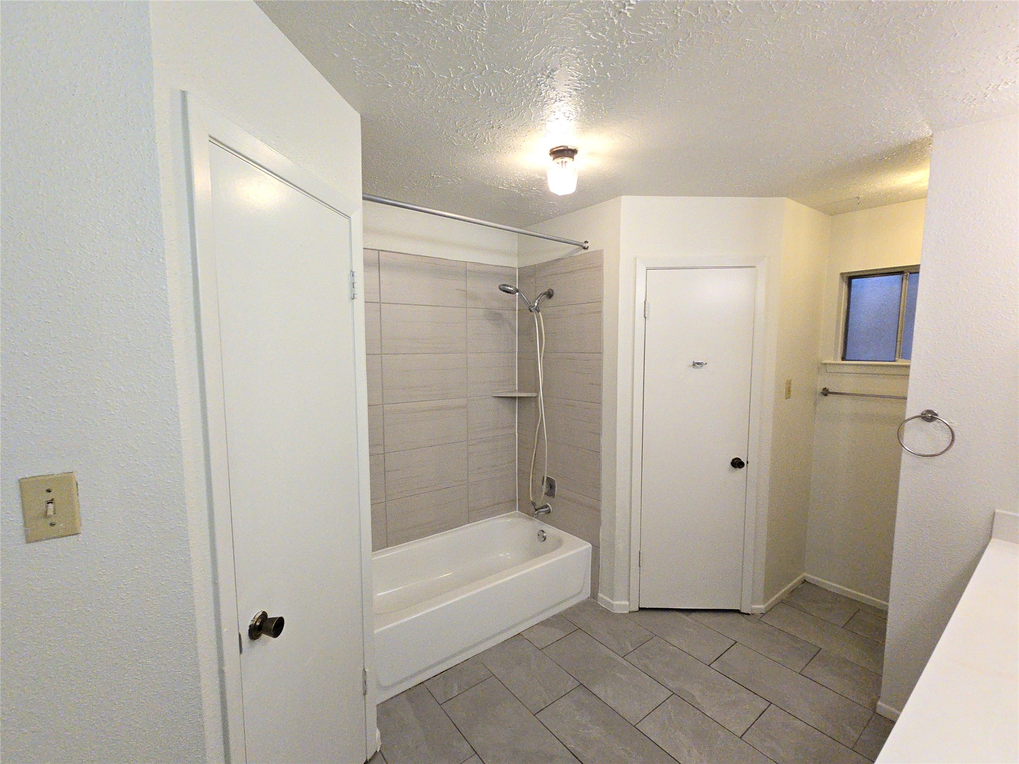 10906 Maple Rock Drive Humble, TX 77396 - Photo 19 of 27 a bathroom with a bathtub and a shower