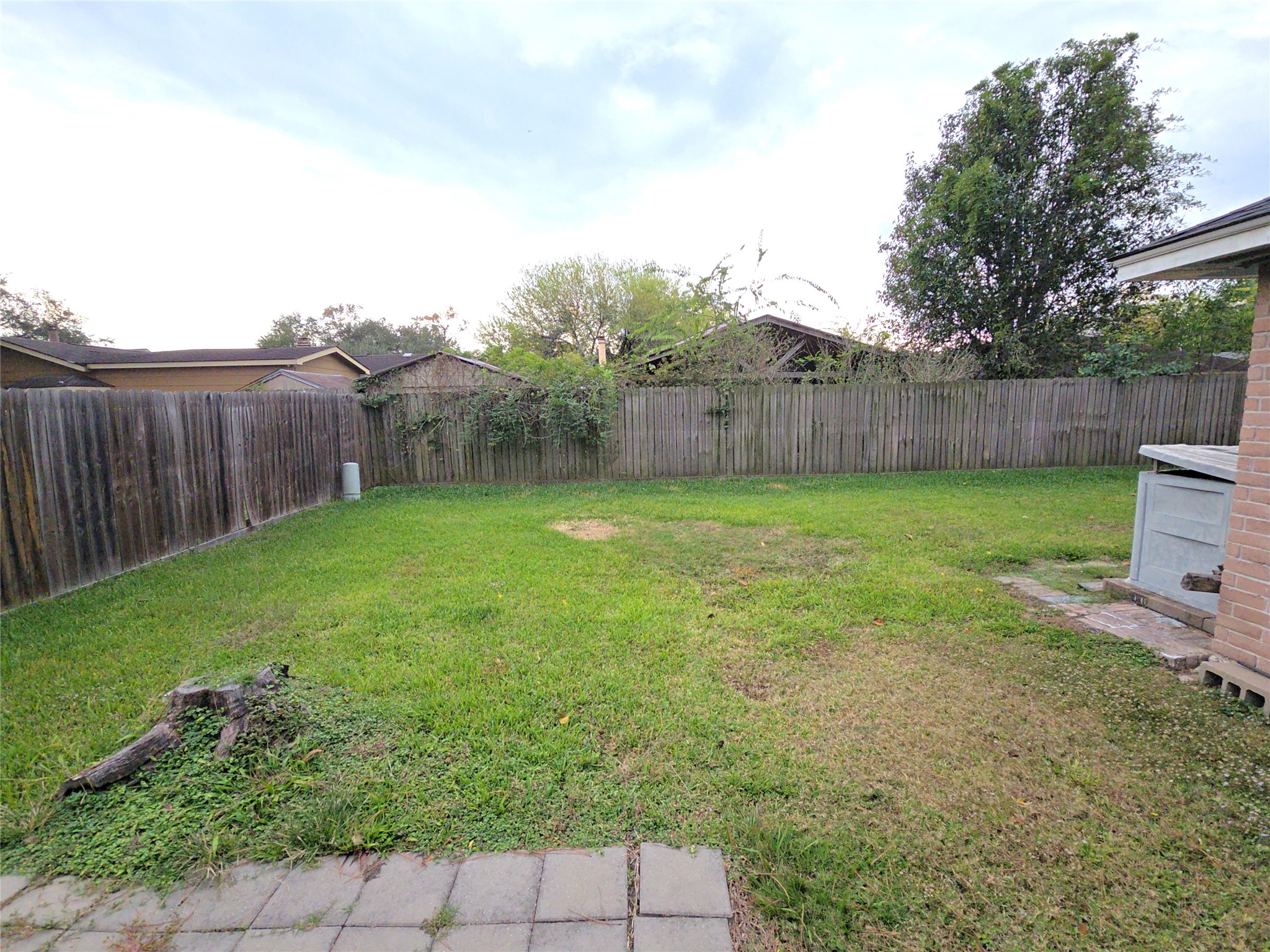 10906 Maple Rock Drive Humble, TX 77396 - Photo 21 of 27 a view of a backyard with a garden