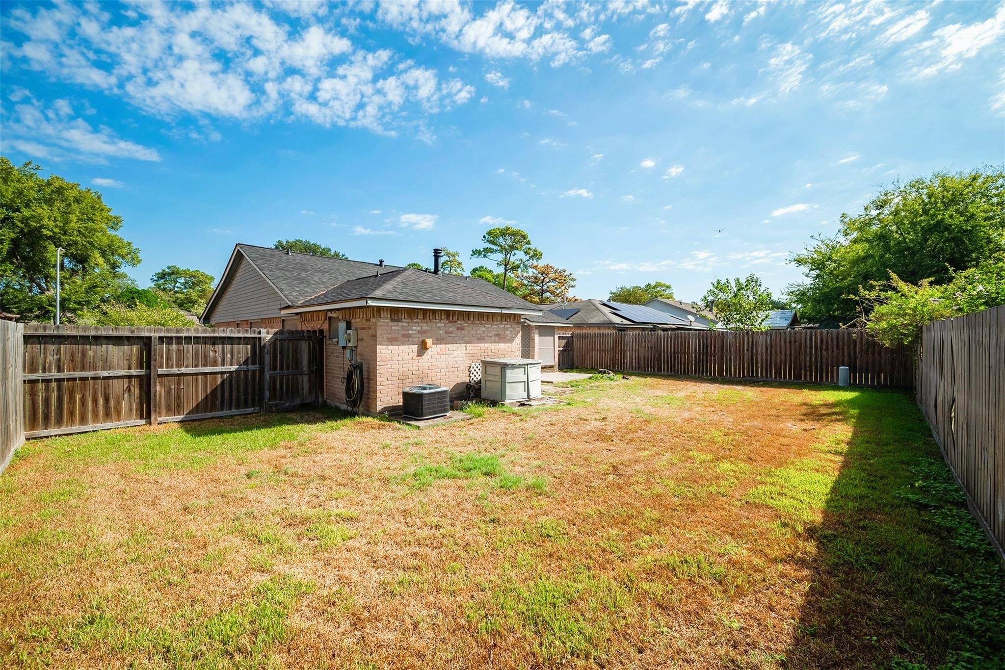 10906 Maple Rock Drive Humble, TX 77396 - Photo 24 of 27 a view of a house with a yard
