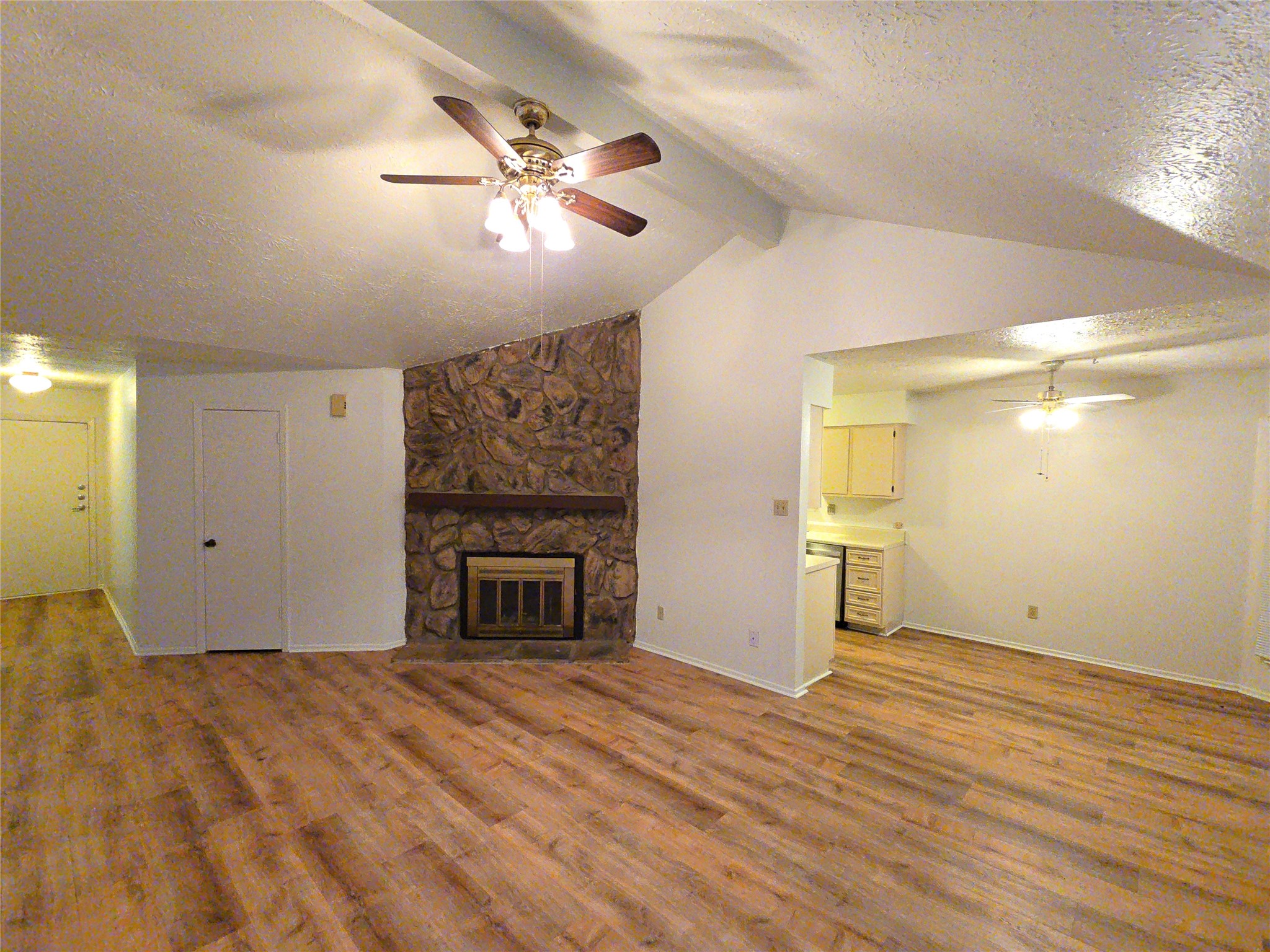 10906 Maple Rock Drive Humble, TX 77396 - Photo 3 of 27 a view of empty room with wooden floor and fireplace