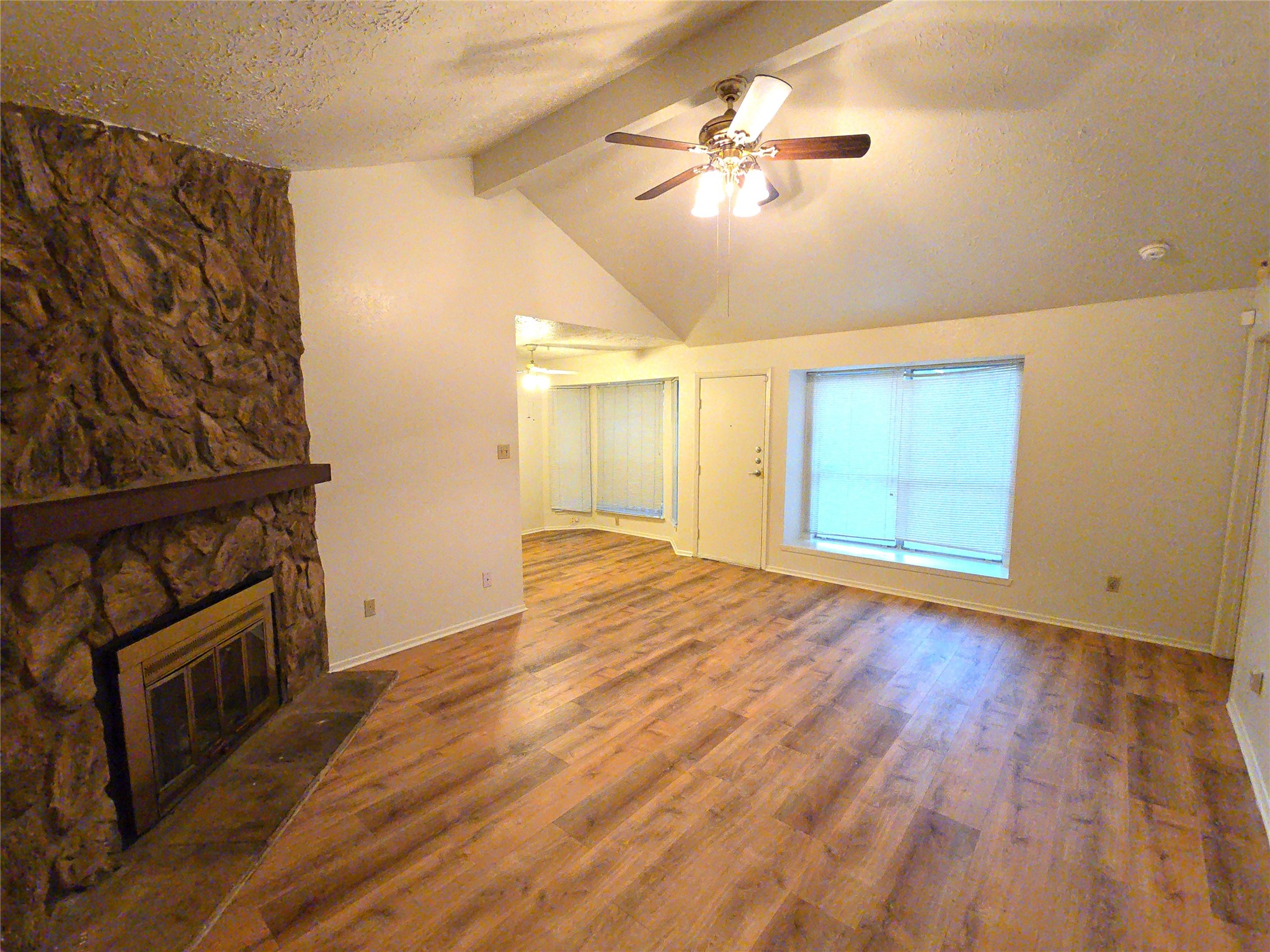 10906 Maple Rock Drive Humble, TX 77396 - Photo 5 of 27 wooden floor in an empty room with a window