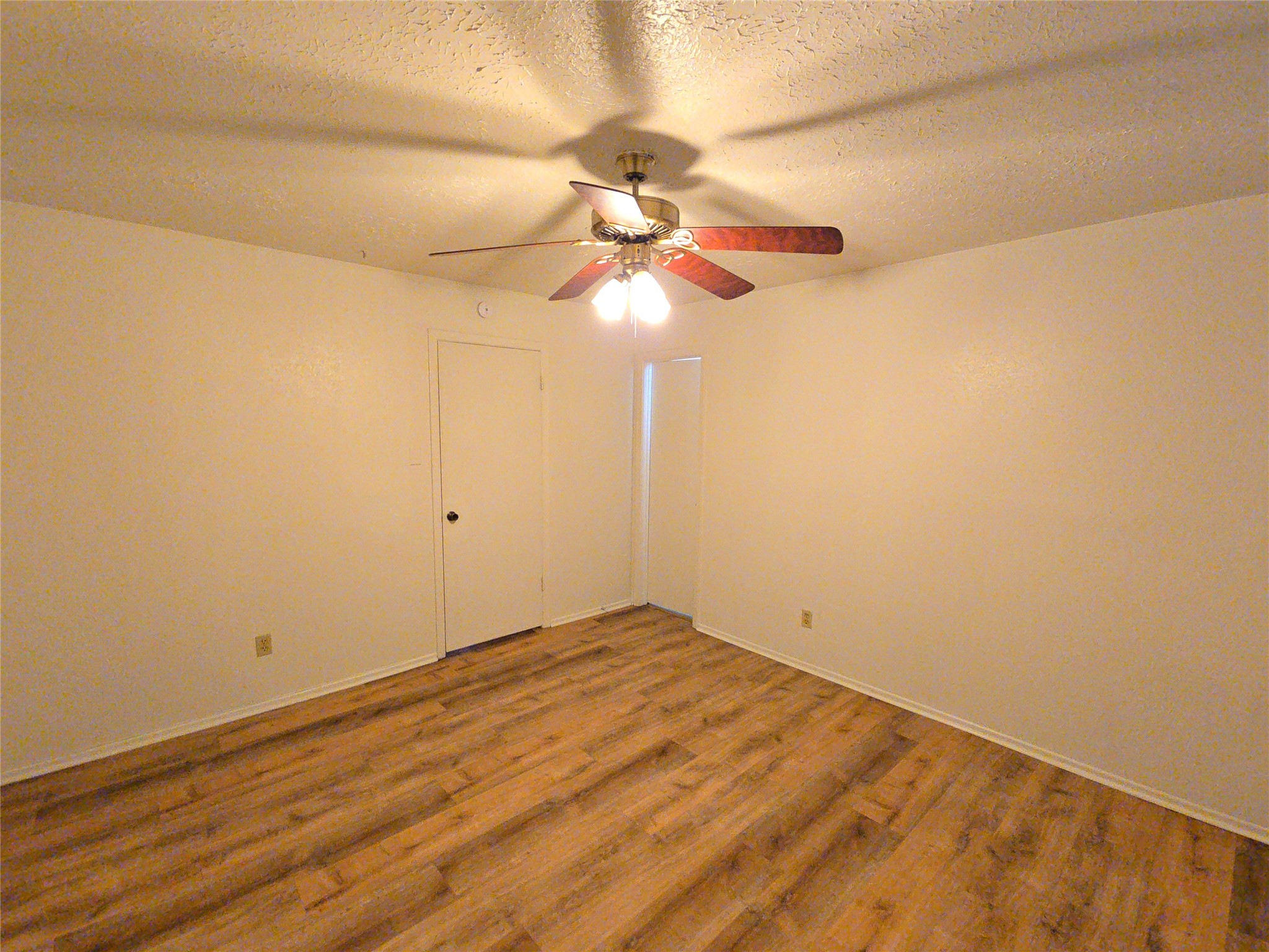 10906 Maple Rock Drive Humble, TX 77396 - Photo 6 of 27 a view of empty room with wooden floor