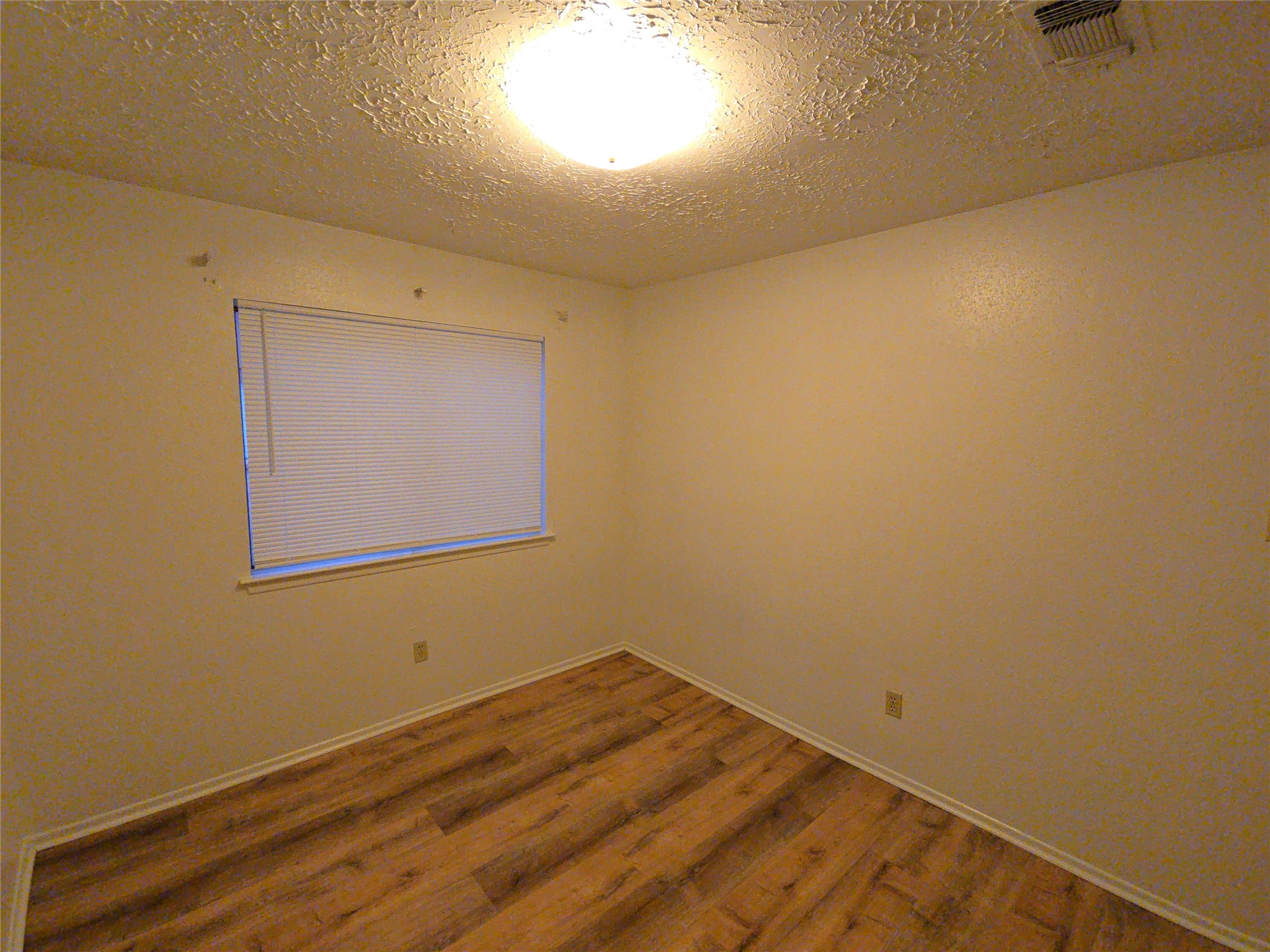 10906 Maple Rock Drive Humble, TX 77396 - Photo 8 of 27 a view of a room with wooden floor